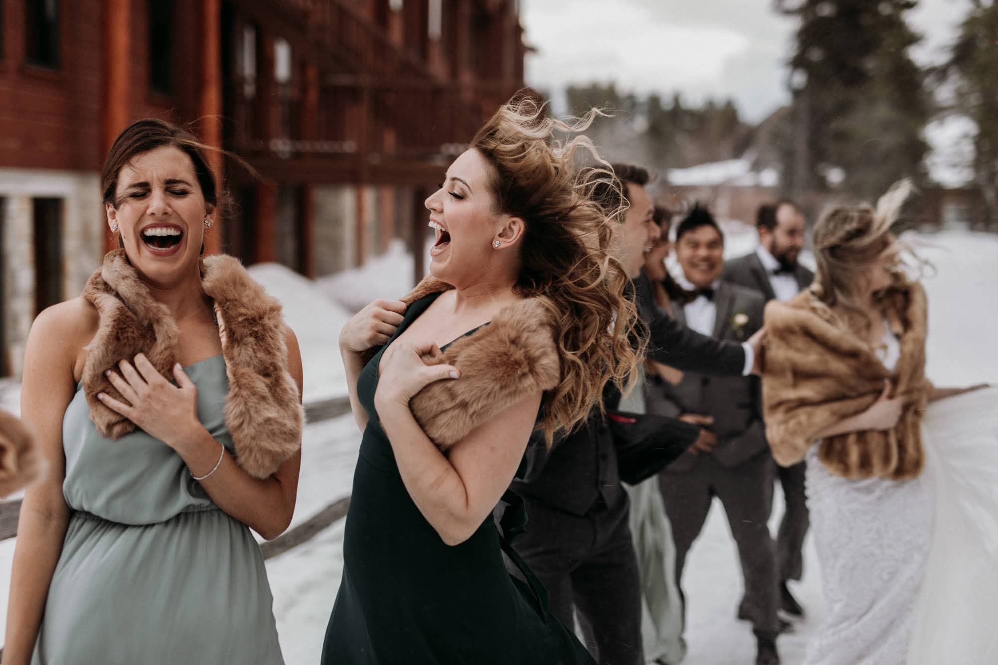 winter wedding bride groom bridal party fur bridesmaids windy hair frozen