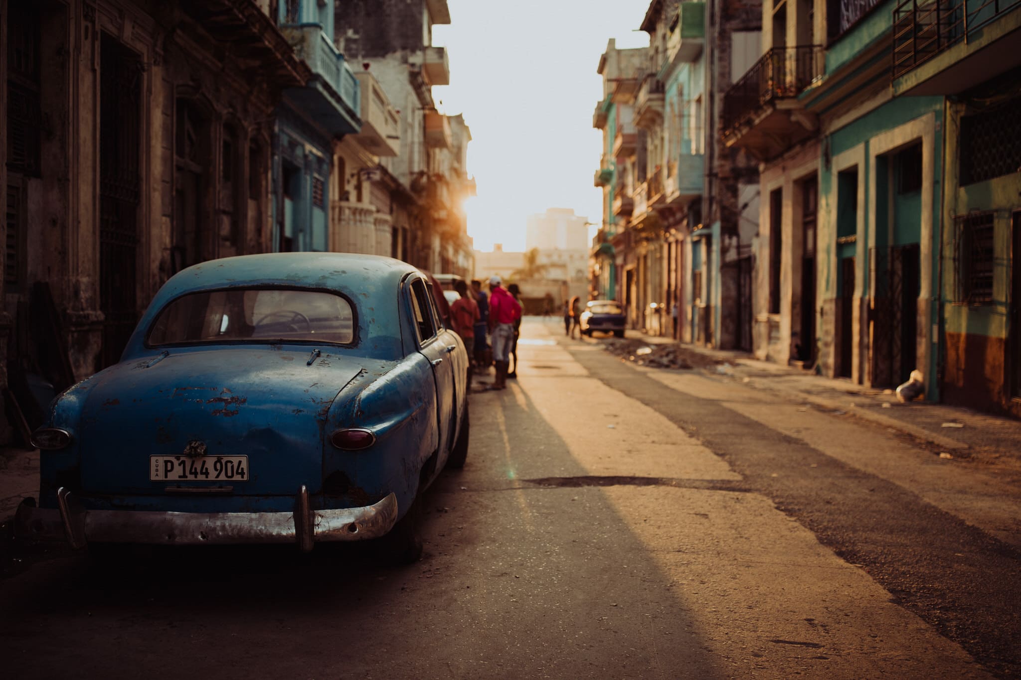 Classic cars at sunset in Centro Havana. Travel photographer Brent Calis.