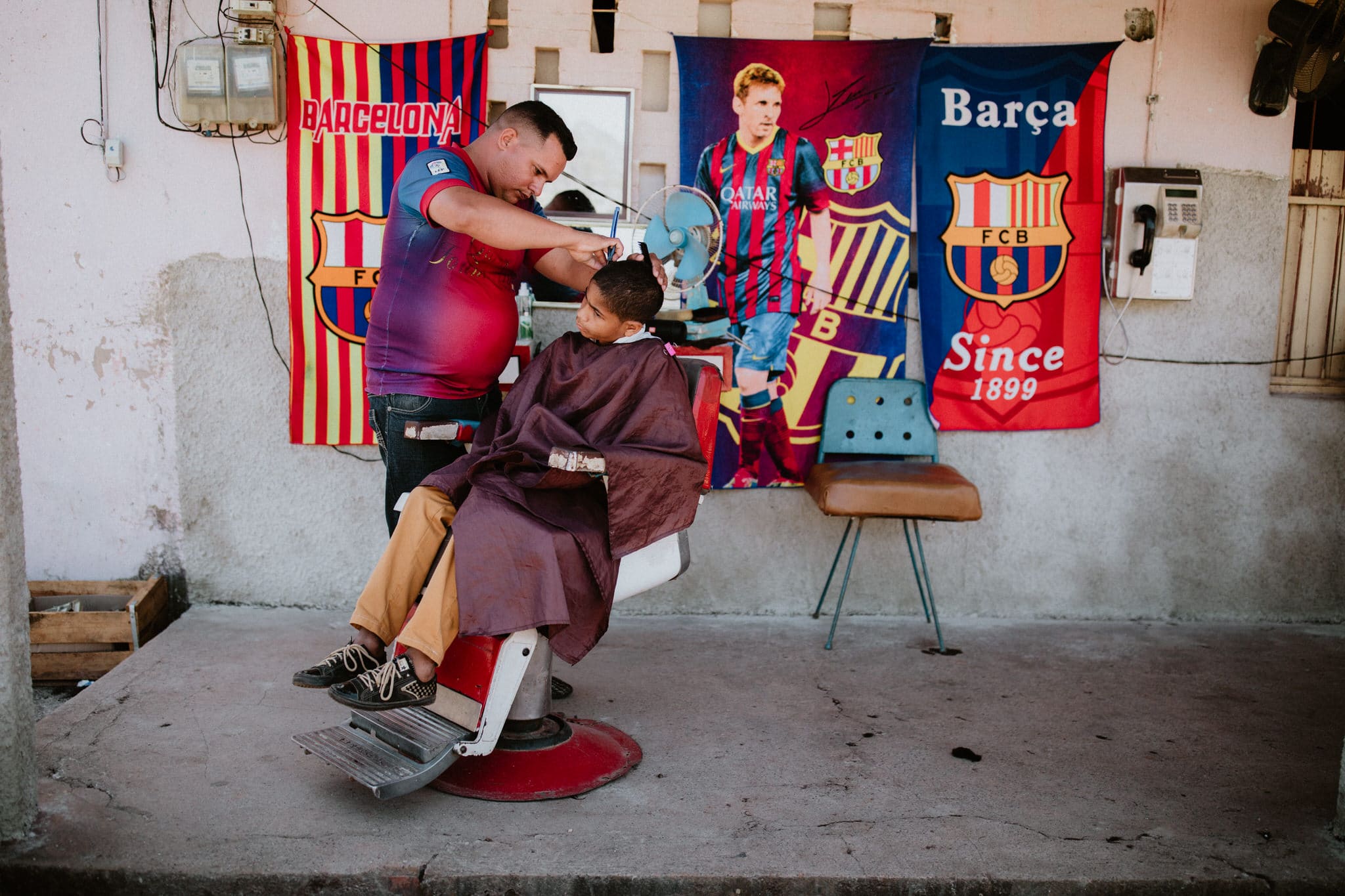 Barbershop street photography in Vinales, Cuba. Wedding and travel photographer Brent Calis.