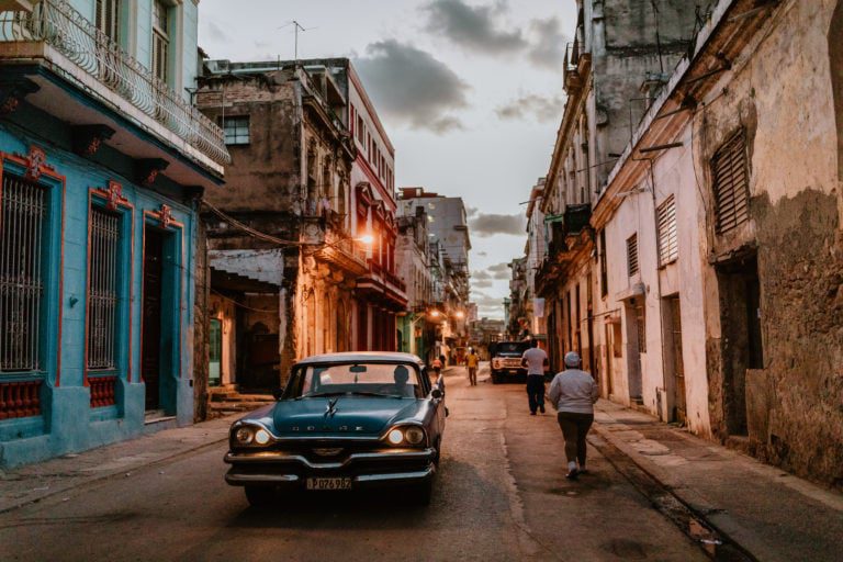 A blue Dodge at dusk in Havana, one of the classic cars of cuba. Travel photographer Brent Calis.