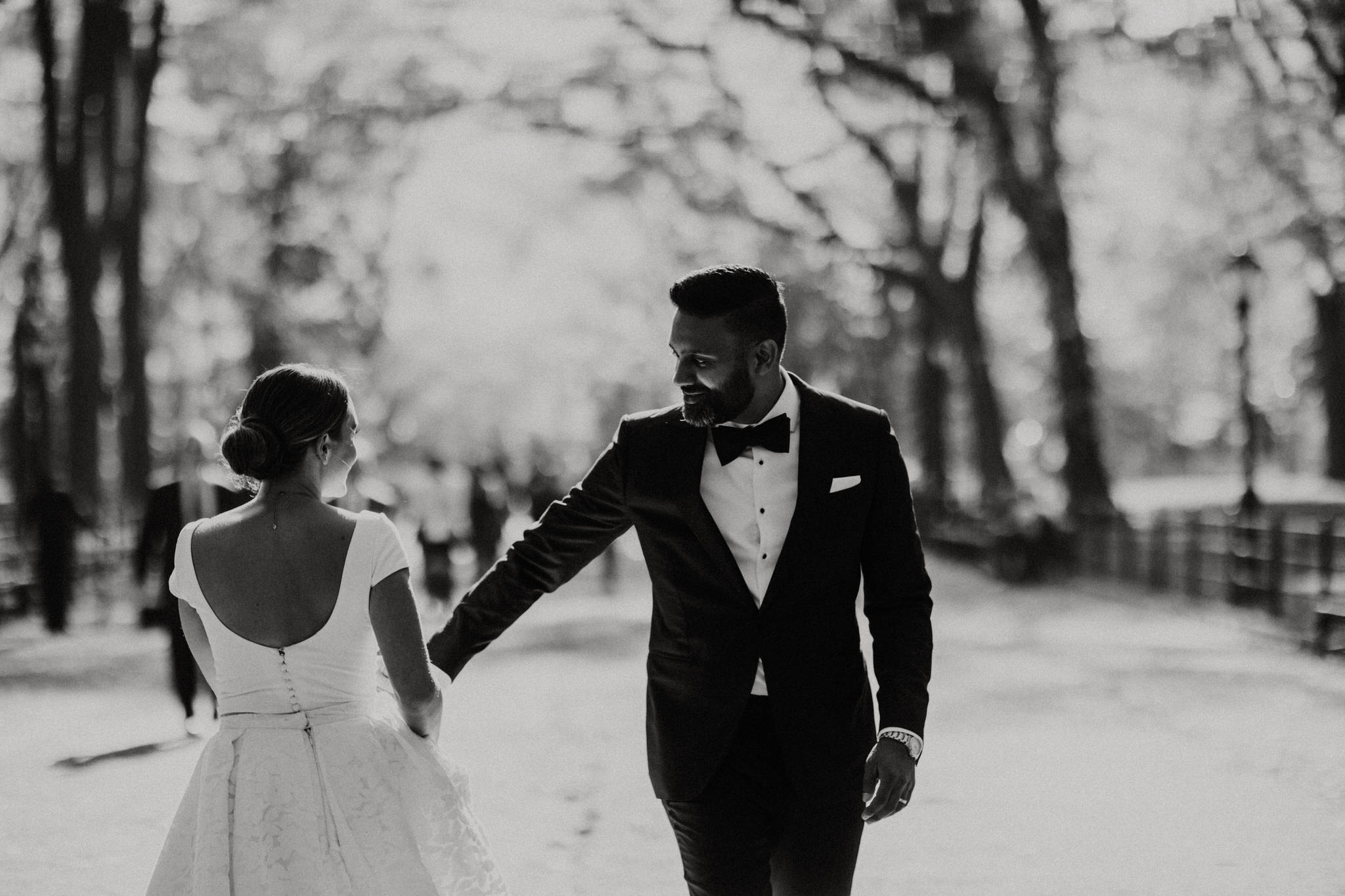 Black and white portrait of the bride and groom dancing in Central Park, New York City. Wedding Photographer Brent Calis.