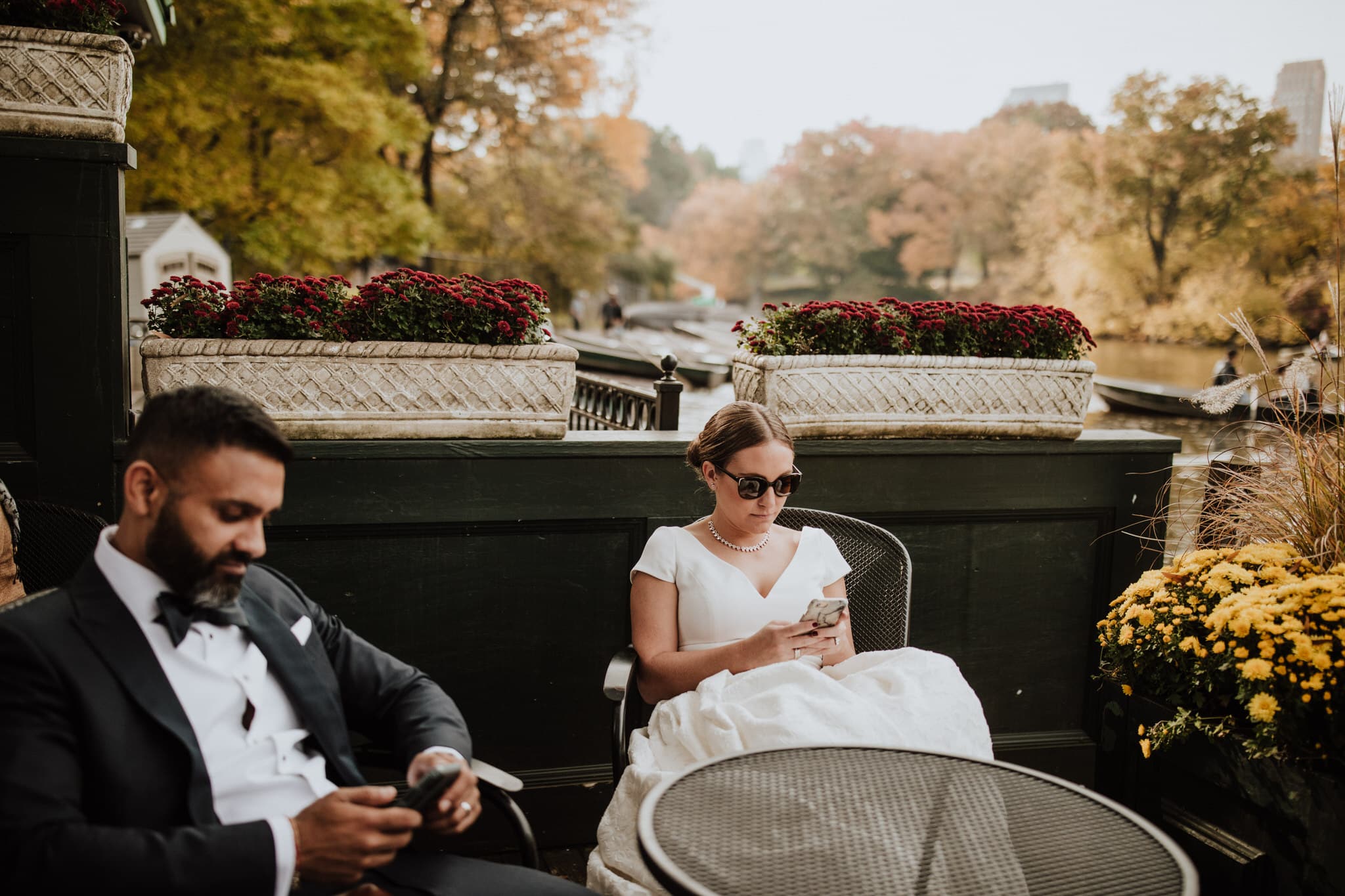 The bride and groom take a break at Tavern on the Green in Central Park, New York City. Wedding Photographer Brent Calis.