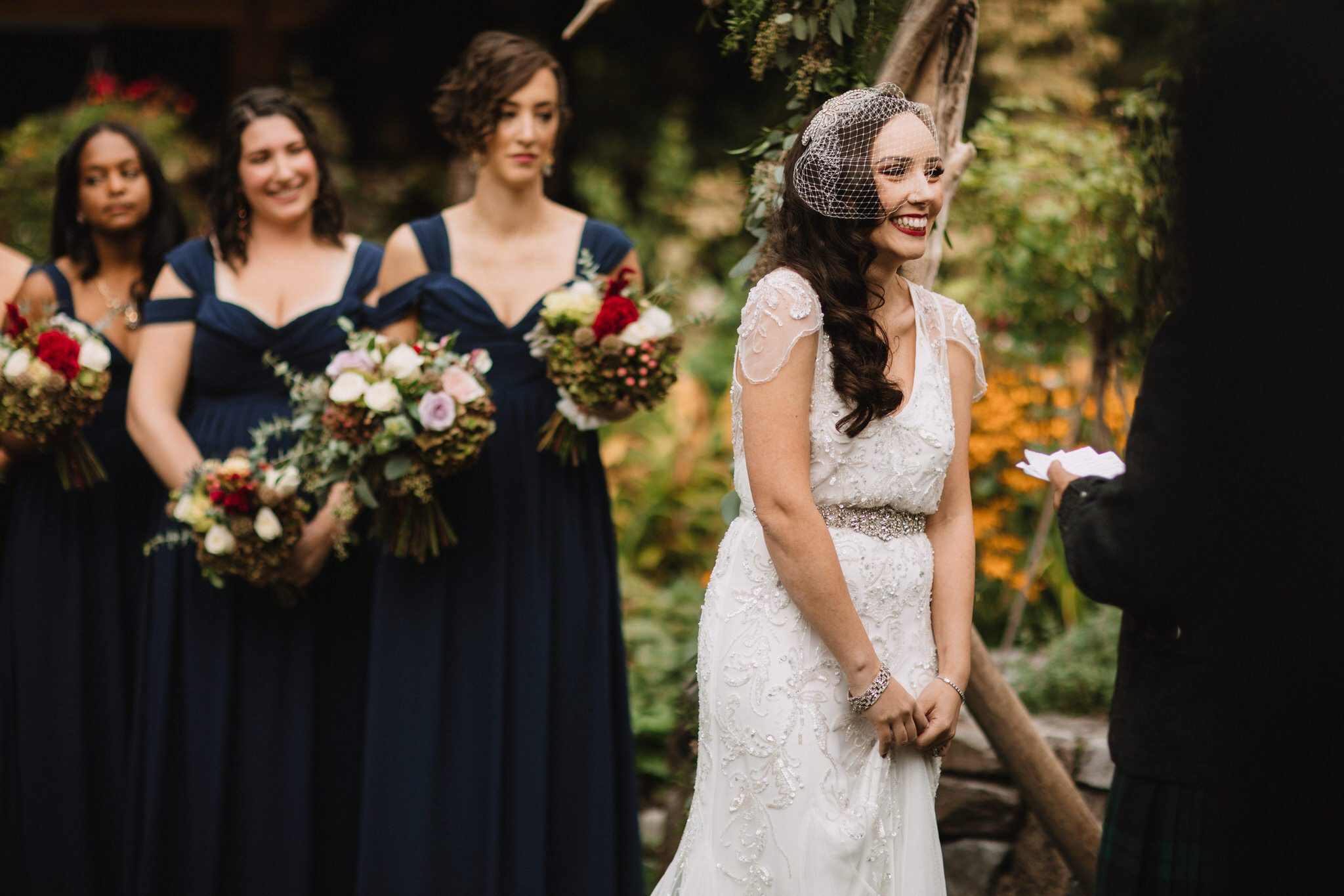 Brides reaction to grooms vows at Whistler. Destination wedding photographer Brent Calis.