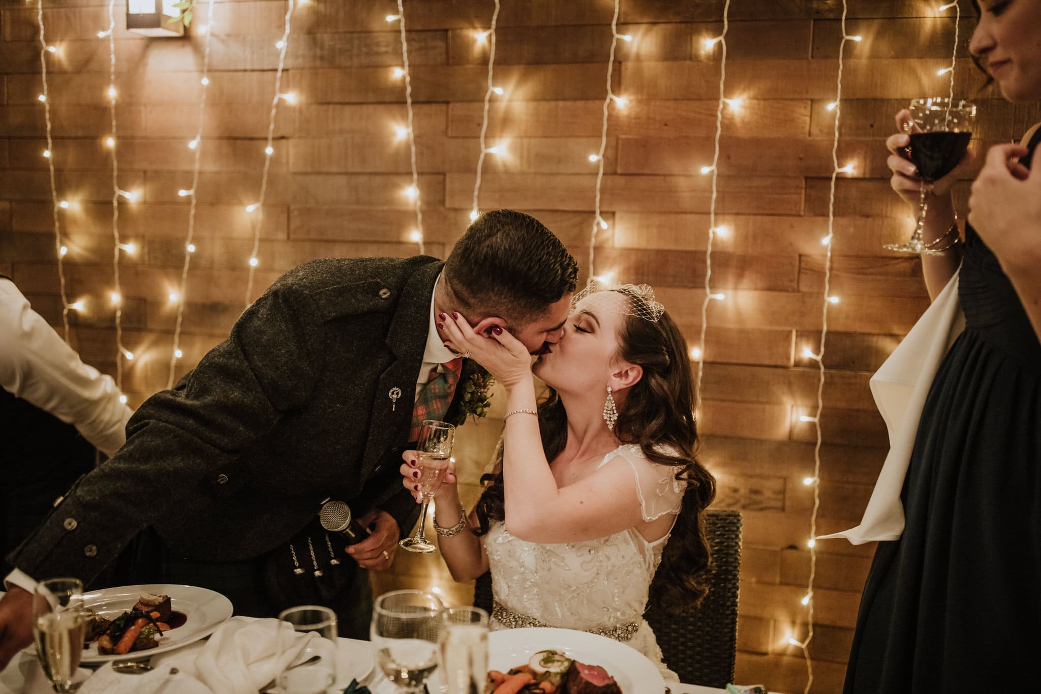 Bride and groom kiss during wedding reception at Brew Creek Centre Whistler. Destination wedding photographer Brent Calis.
