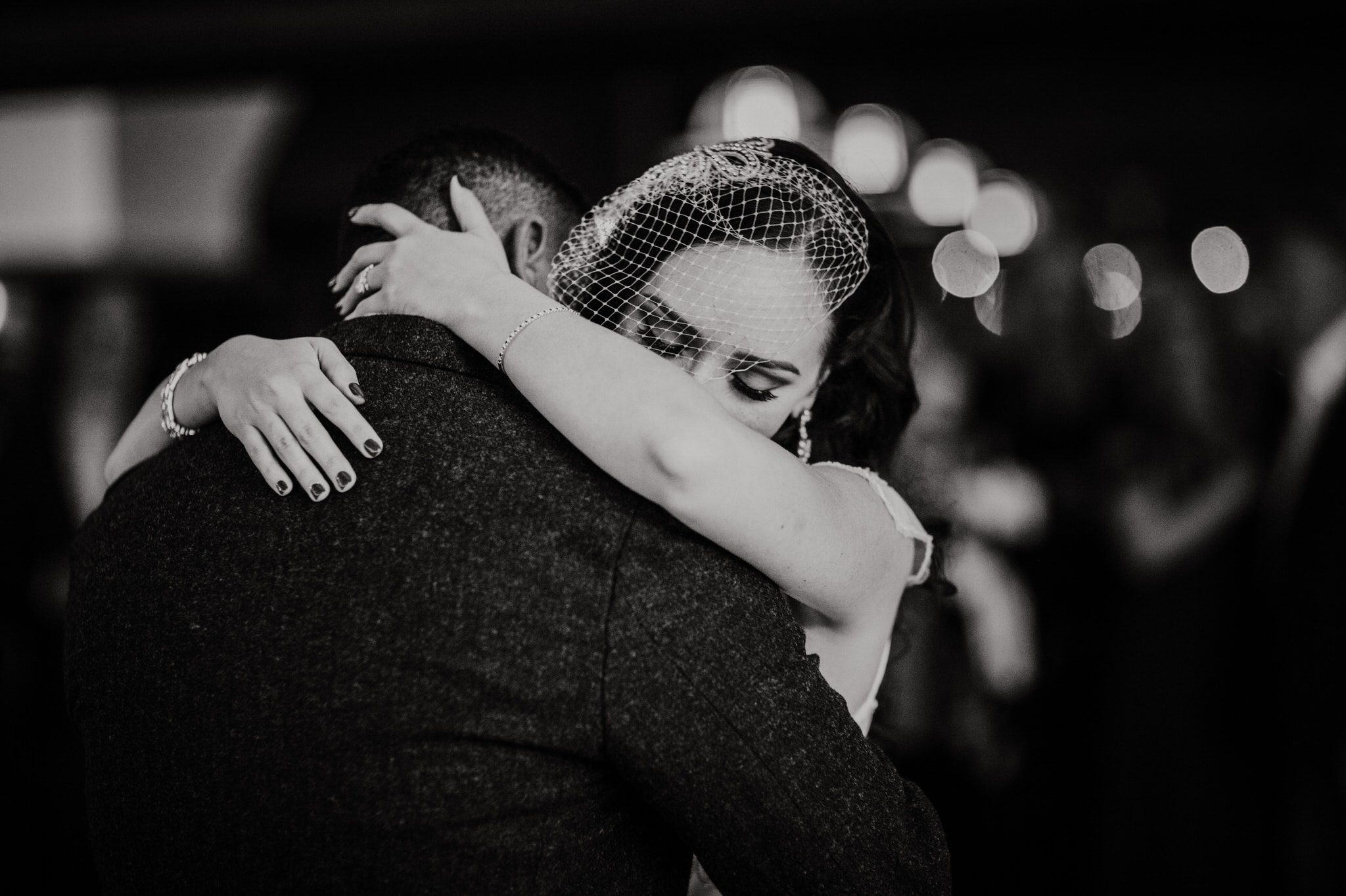 Black and white photo of bride and groom dancing during their Whistler Mountians wedding. Destination wedding photographer Brent Calis.