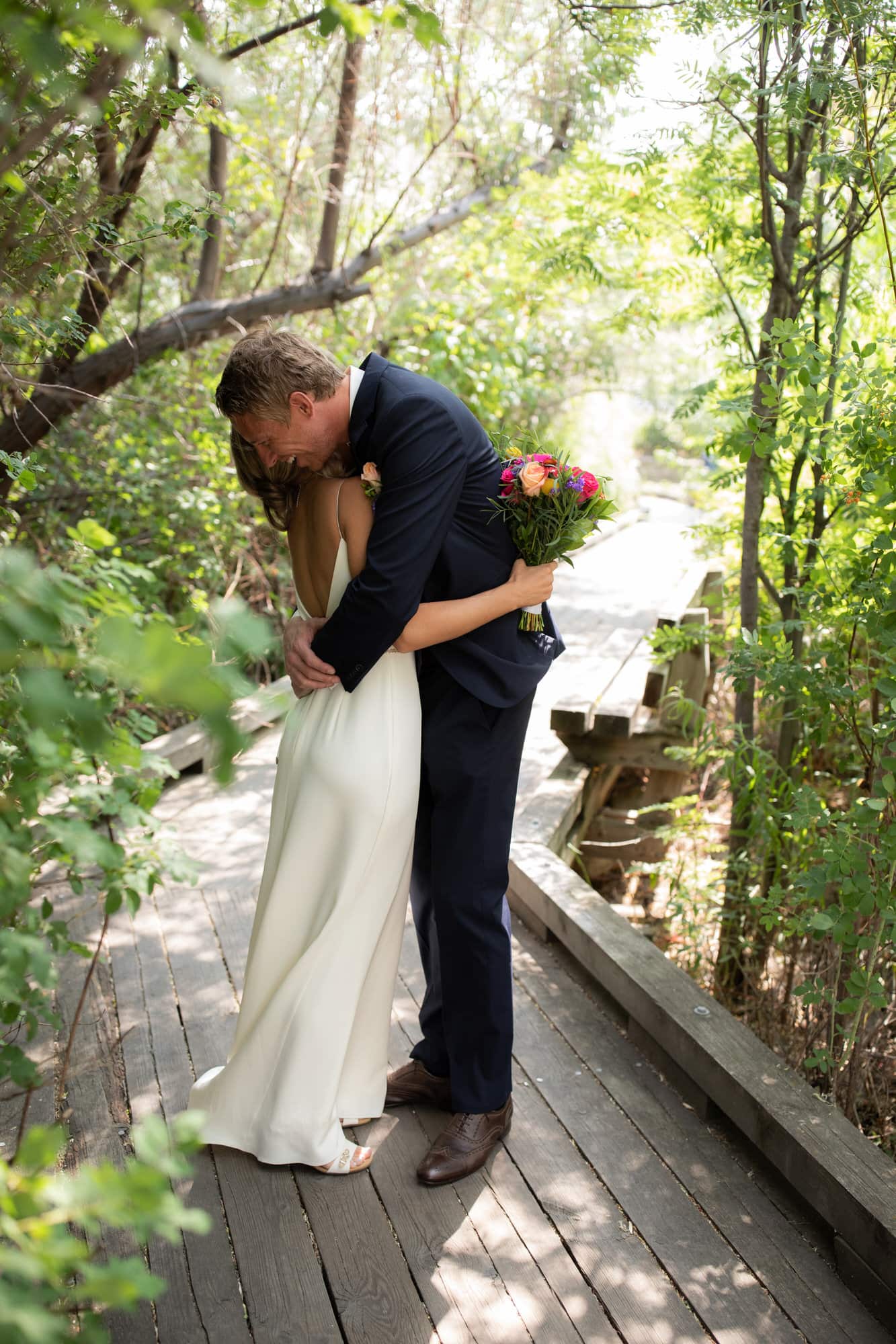 Bride and groom embrace during first look. Destination wedding photographer Brent Calis.