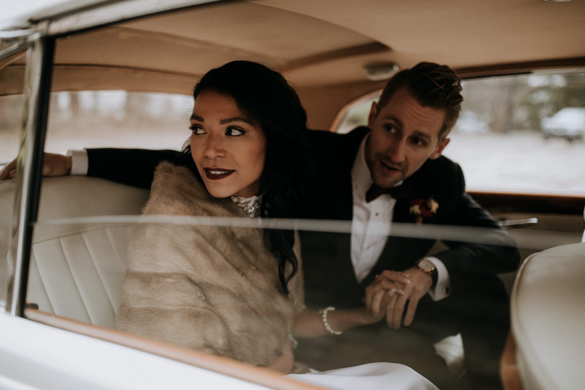 Bride and groom in classic car at Graydon Hall Manor Wedding in Toronto