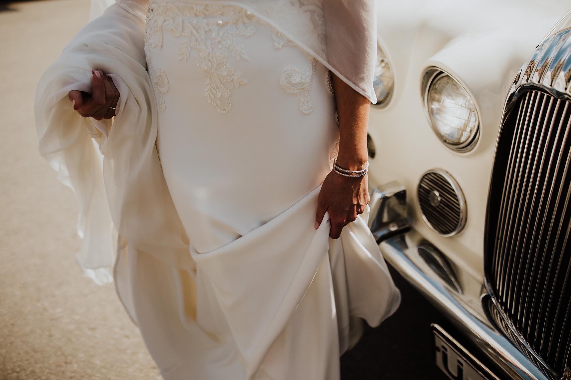 Entrepots Dominion Wedding In Montreal - Bride in front of luxury car - Wedding Photographer Brent Calis