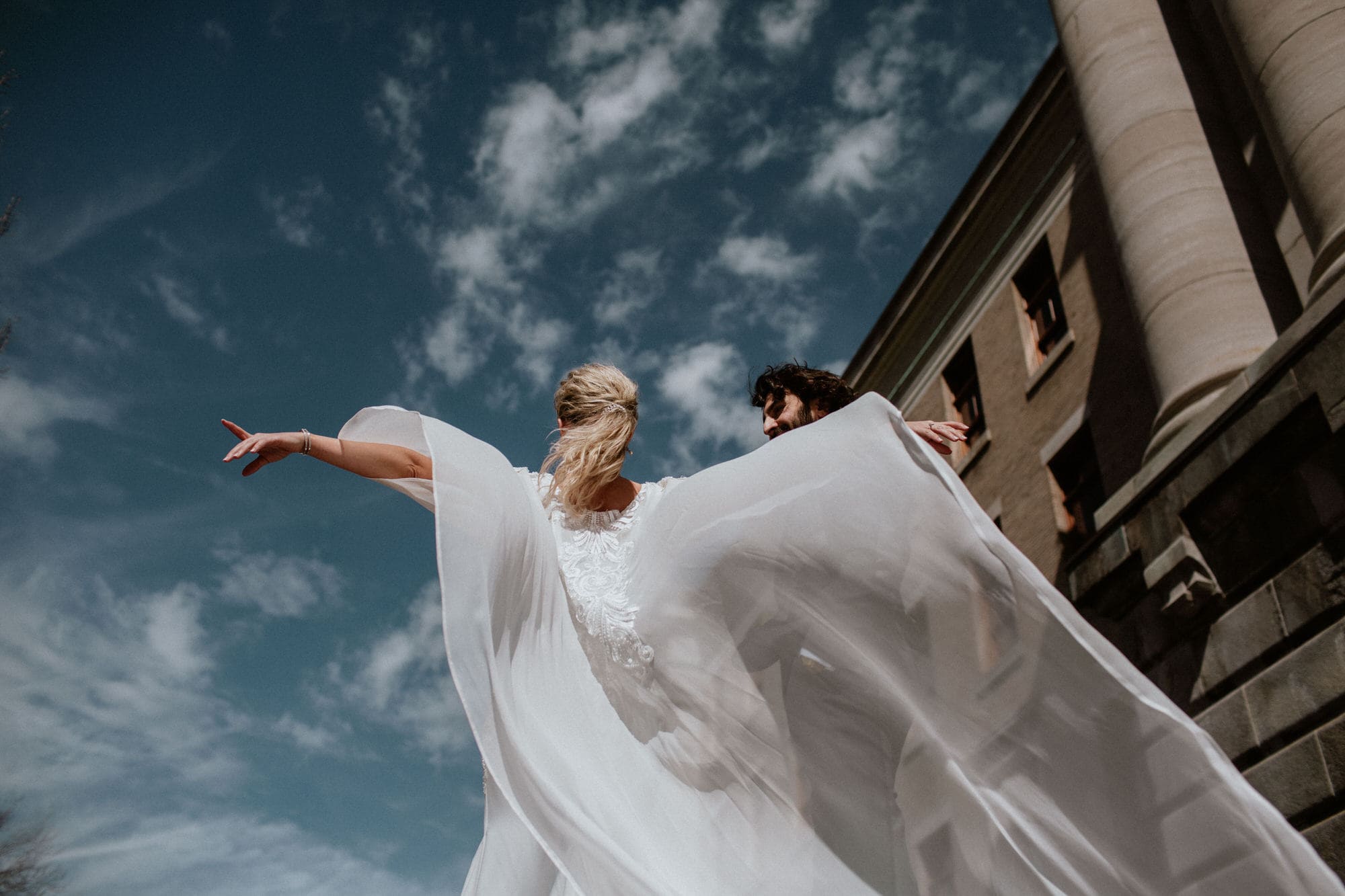 Entrepots Dominion Wedding In Montreal - Bride with flowing cape - Wedding Photographer Brent Calis